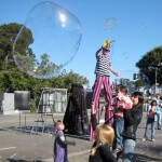 Stretch on his four foot tall stilts, making big bubbles at the Exploratorium in San Francisco