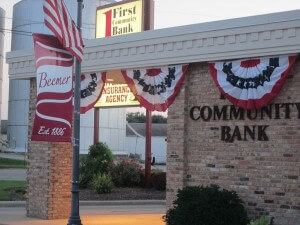 First Community Bank with corn silo in the background.