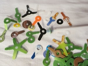 Stretch-a-Straws® connectors die cut from household waste such as milk and ice cream cartons, laundry detergent jugs, cereal boxes and the like.